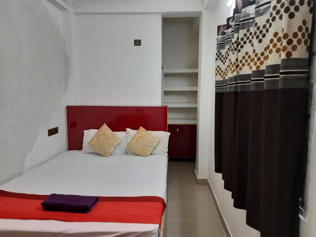 Postel nebo postele na pokoji v ubytování Sukun Guest House