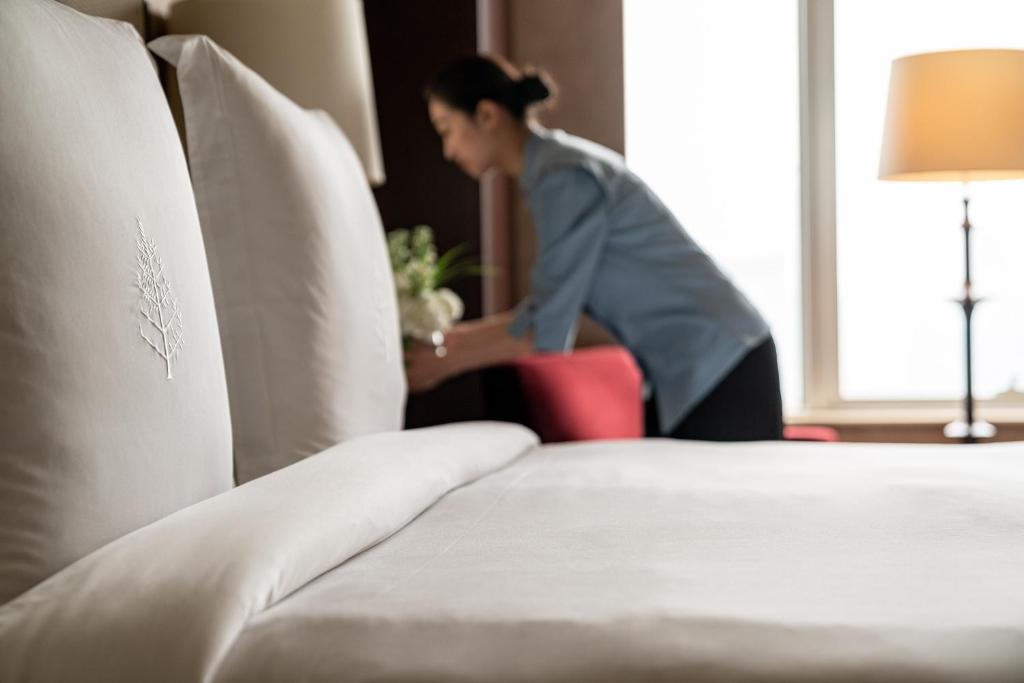 Postel nebo postele na pokoji v ubytování Four Seasons Hotel Beijing