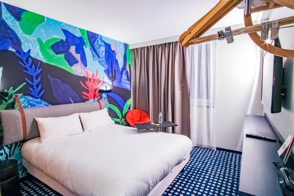 Postel nebo postele na pokoji v ubytování ibis Styles Albertville
