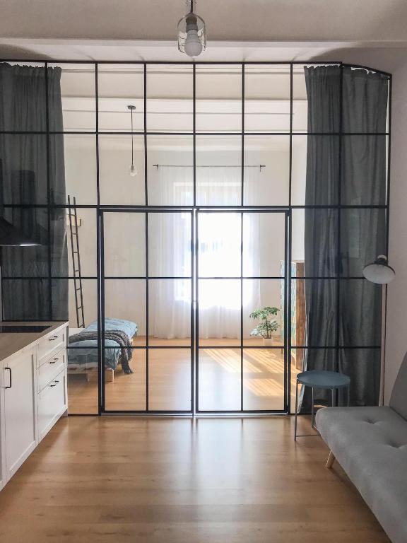 a living room with a sliding glass door at Apartmány Tyršovka - u Janských Lázní, Krkonoše in Svoboda nad Úpou