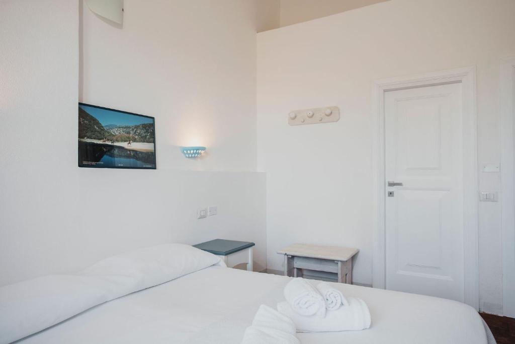 Postel nebo postele na pokoji v ubytování Resort Fior di Sardegna