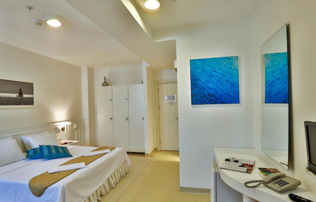 Postel nebo postele na pokoji v ubytování Han Hotel