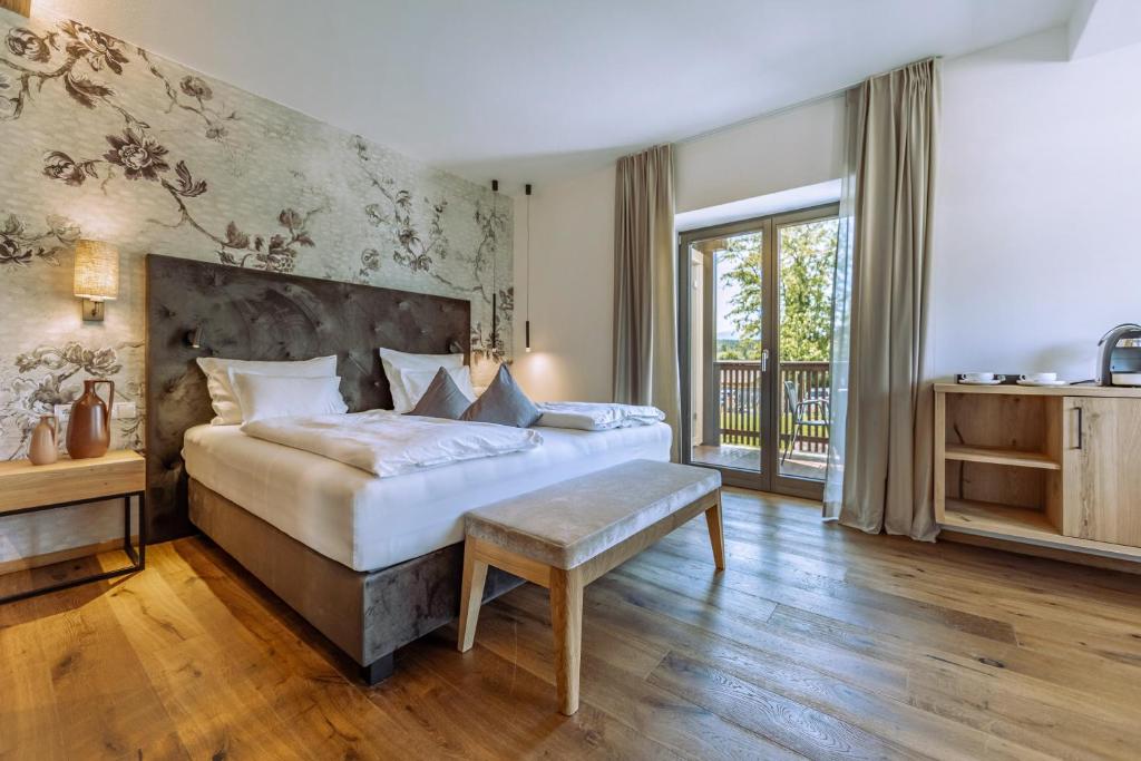 Postel nebo postele na pokoji v ubytování Hotel Ansitz Rungghof