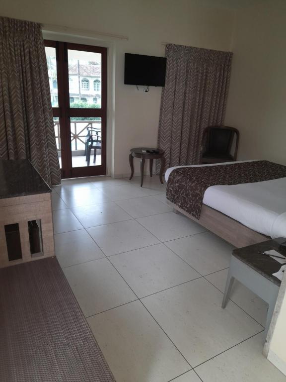 Кровать или кровати в номере Nanu Beach Resort & Spa
