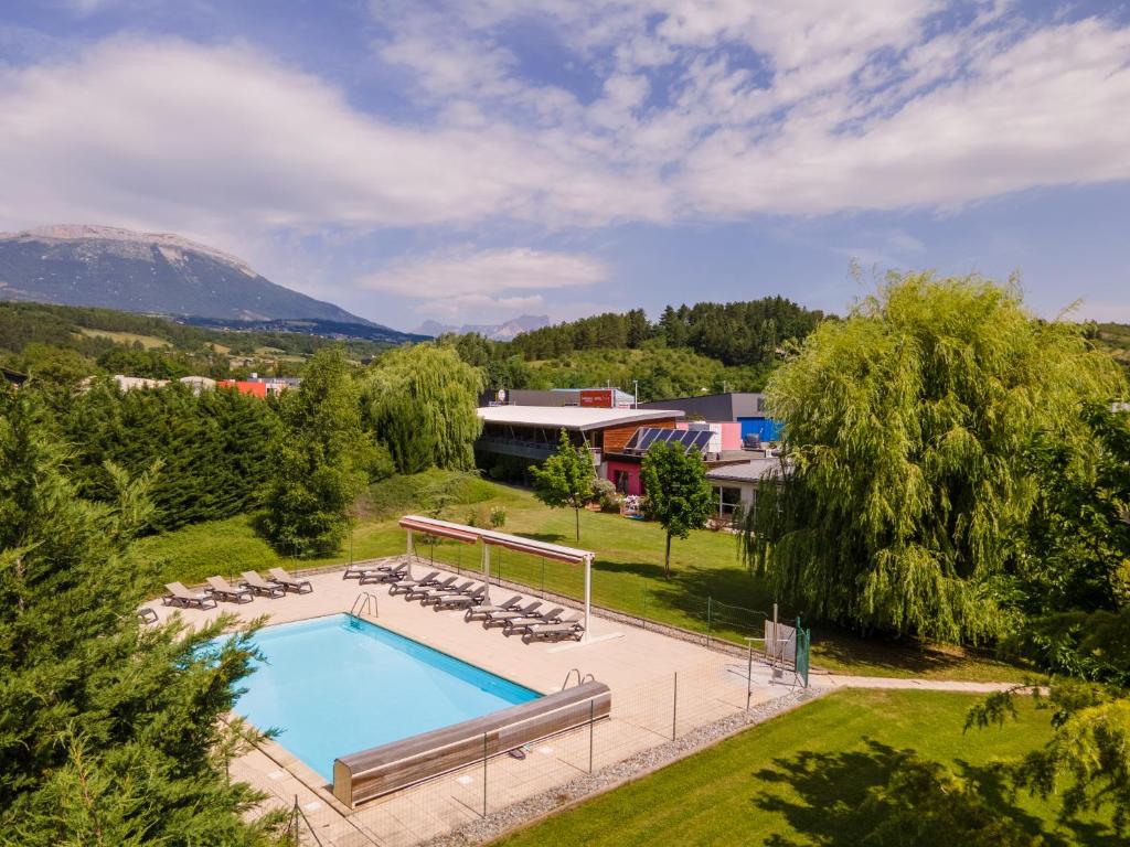 A view of the pool at The Originals Boutique, Hôtel Le Cap, Gap Sud or nearby