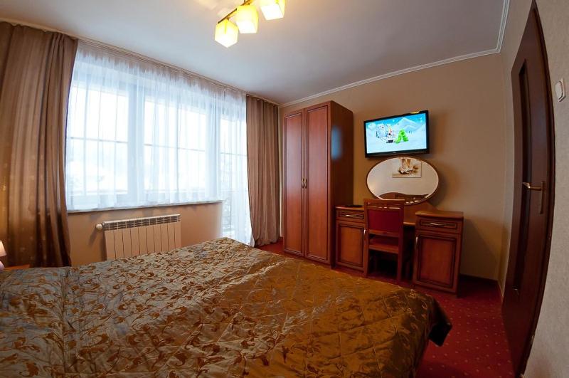 Postel nebo postele na pokoji v ubytování Willa Stok ***