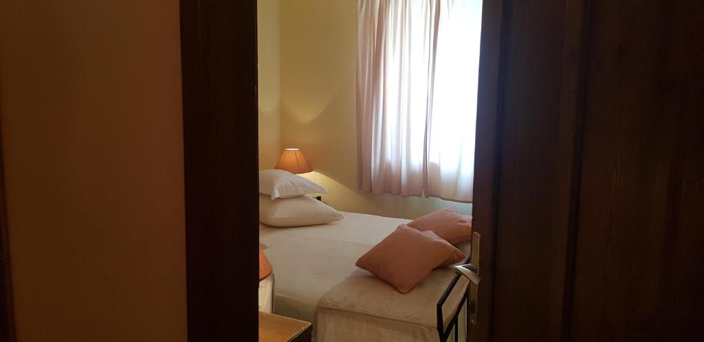 Łóżko lub łóżka w pokoju w obiekcie Rooms & Apartment STELIO