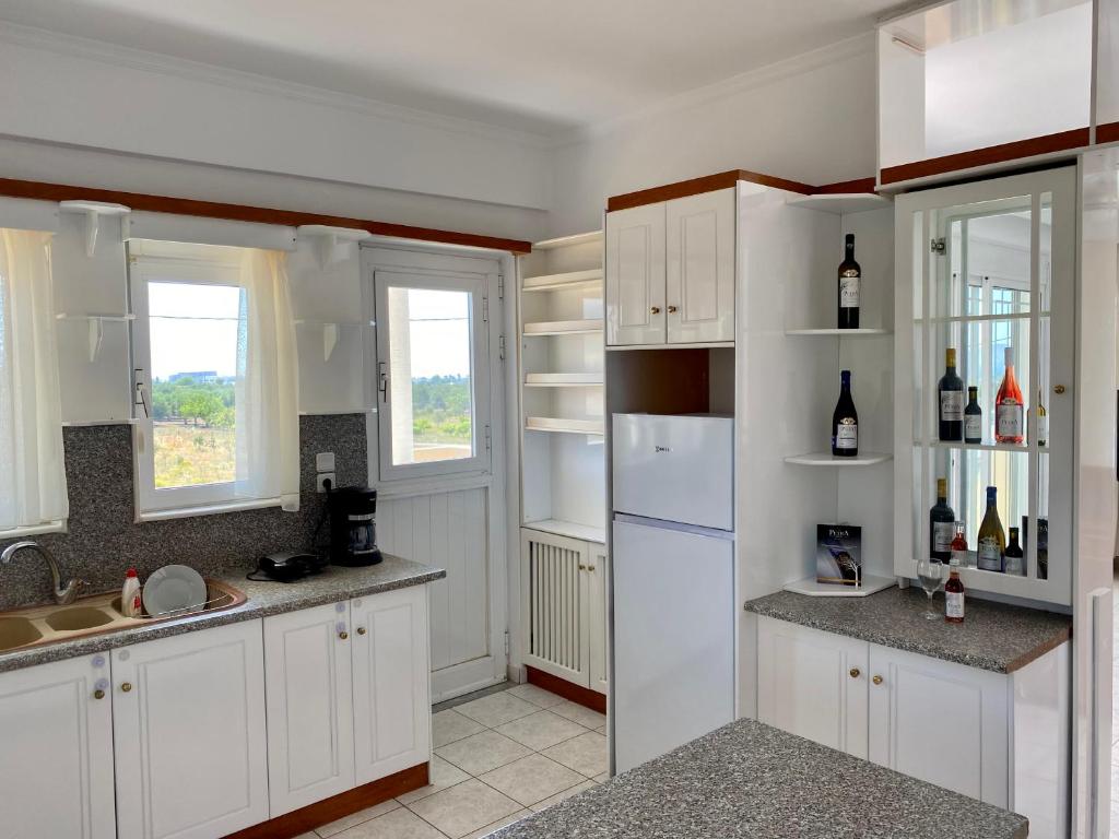 A kitchen or kitchenette at Panoramic View, House, at Zipari Village "2"