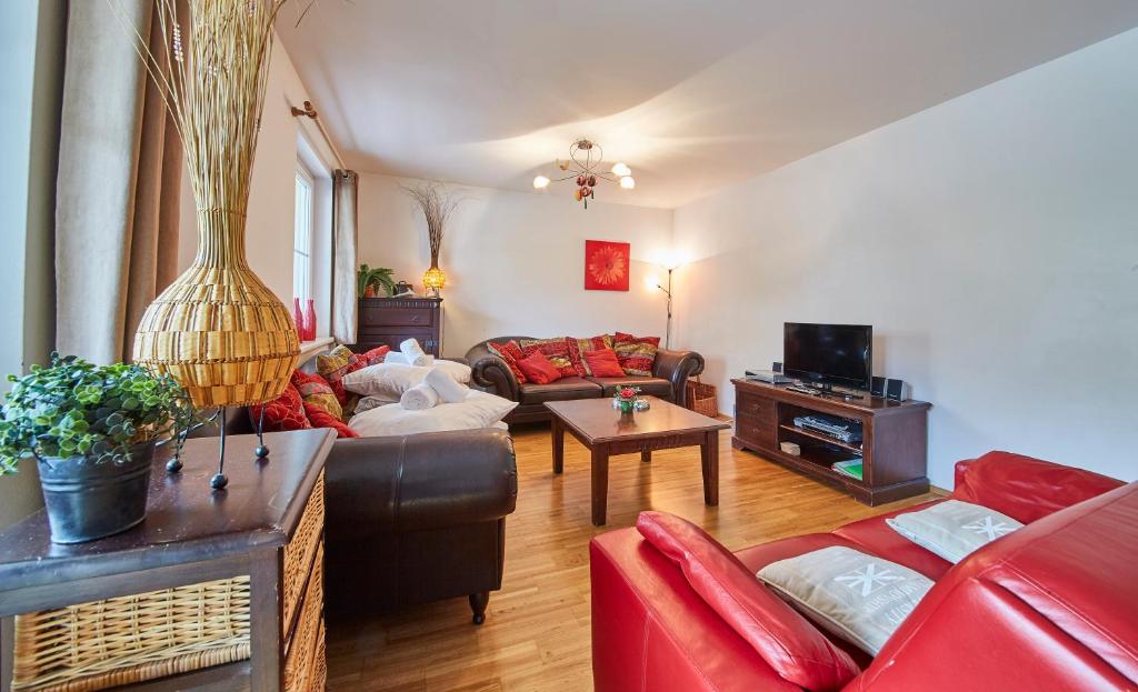 a living room with a couch and a table at Appartement Iglsberg Top 2 in Saalbach-Hinterglemm