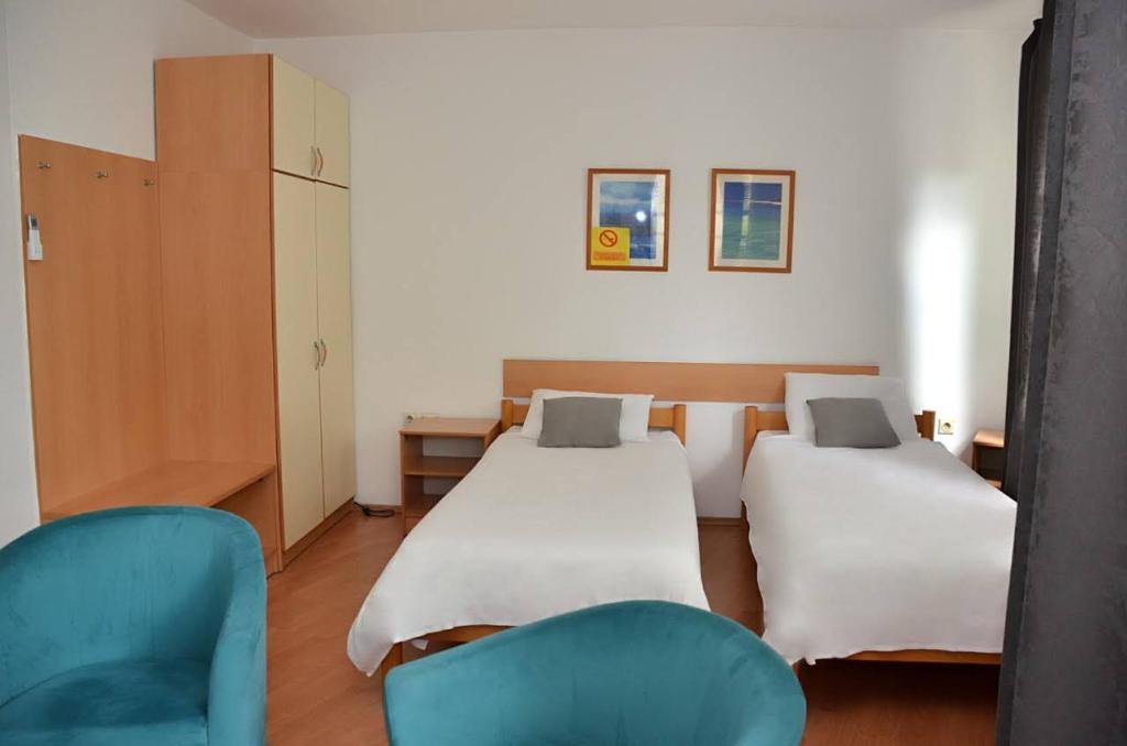 Postel nebo postele na pokoji v ubytování Hotel 7