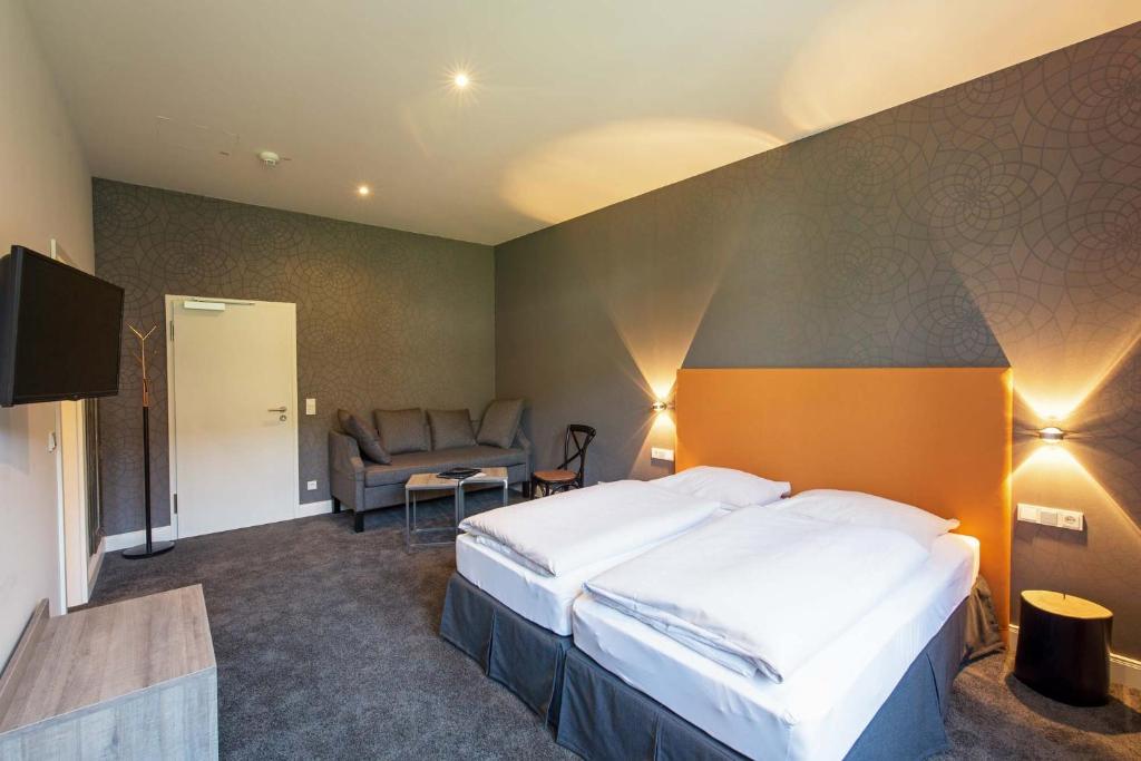 Ein Bett oder Betten in einem Zimmer der Unterkunft Hotel Deutschherrenhof