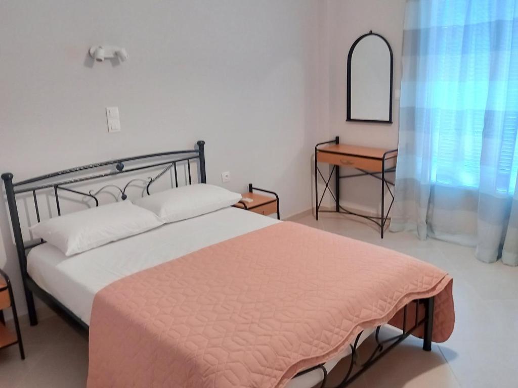 Postel nebo postele na pokoji v ubytování ΒΑΒΟΥΛΙΩΤΗΣ Γ