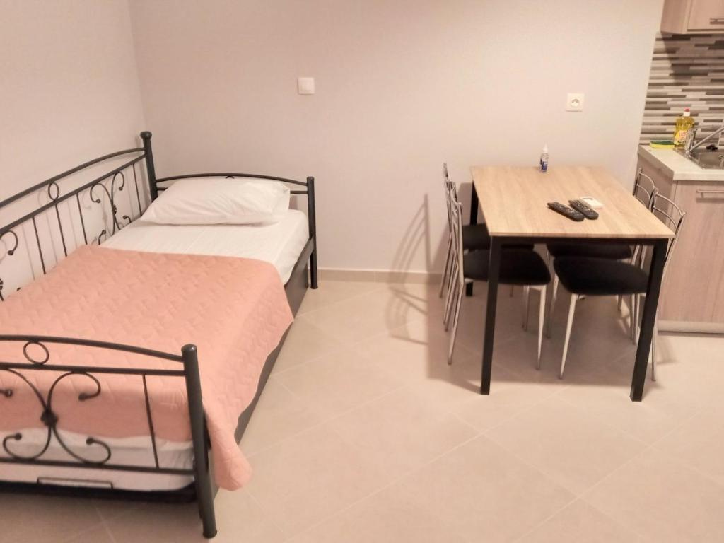 Postel nebo postele na pokoji v ubytování ΒΑΒΟΥΛΙΩΤΗΣ Γ