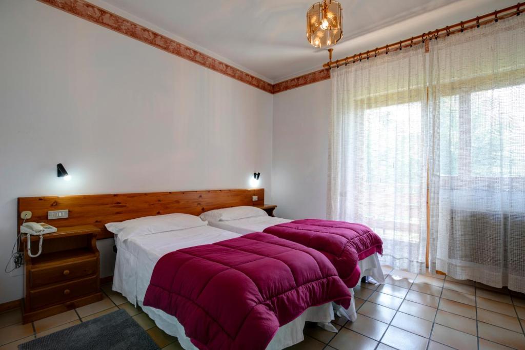 Postel nebo postele na pokoji v ubytování Hotel Petit Foyer