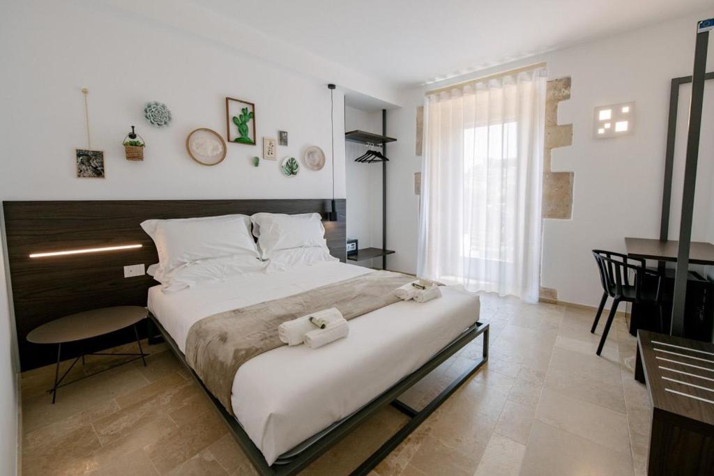 Postel nebo postele na pokoji v ubytování IBLA ROOMS