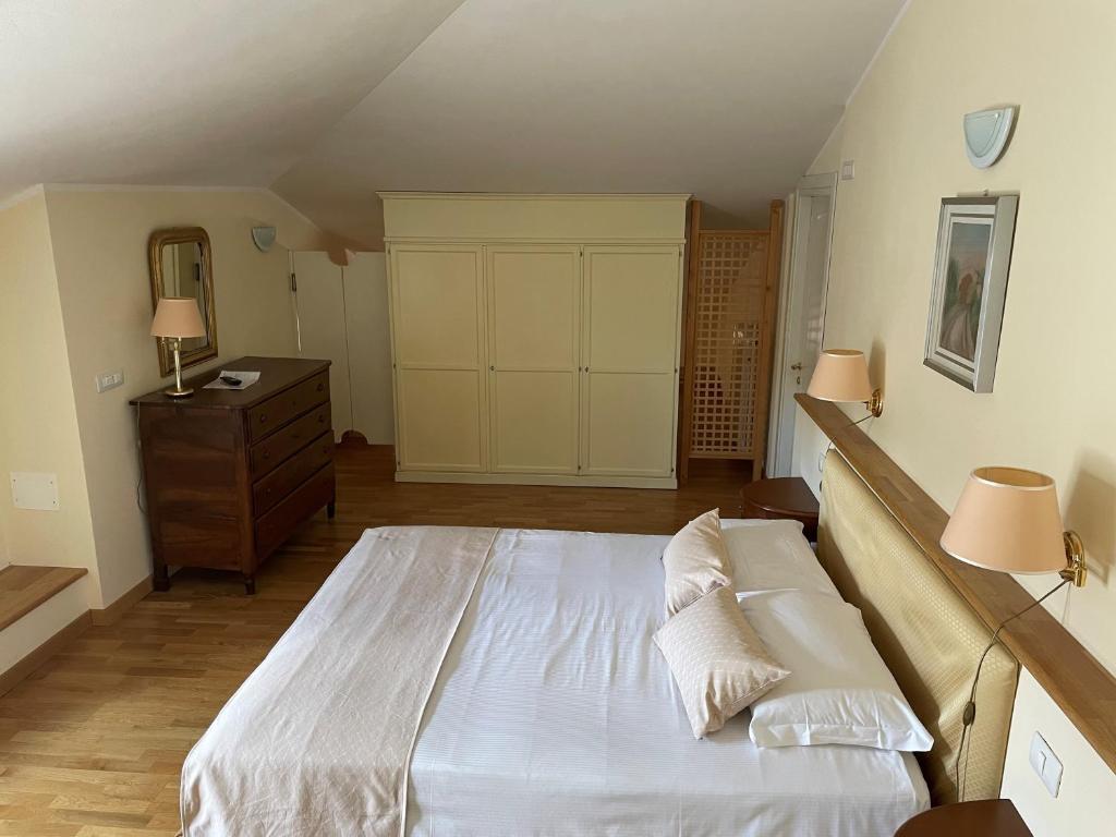 Postel nebo postele na pokoji v ubytování Relais Villa Selle