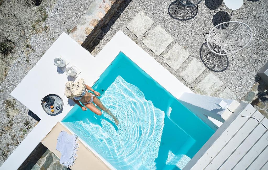 an overhead view of a sign with a woman on a wave at Wise Luxury Suites in Kithnos