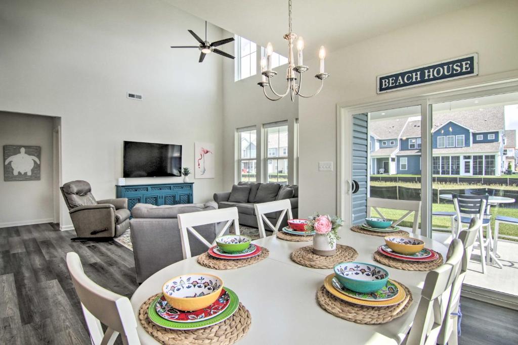a dining room and living room with a table and chairs at Bright Bishops Landing Home Less Than 5 Miles to Beach! in Millville