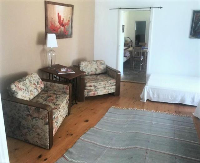 A bed or beds in a room at Tusculanum Panzió