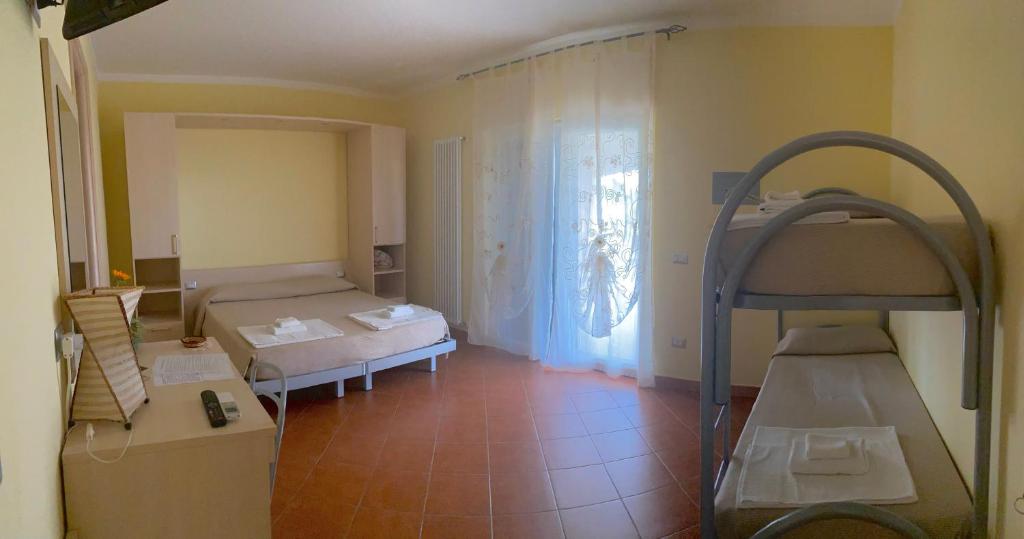 Postel nebo postele na pokoji v ubytování Il Nido Delle Rondini