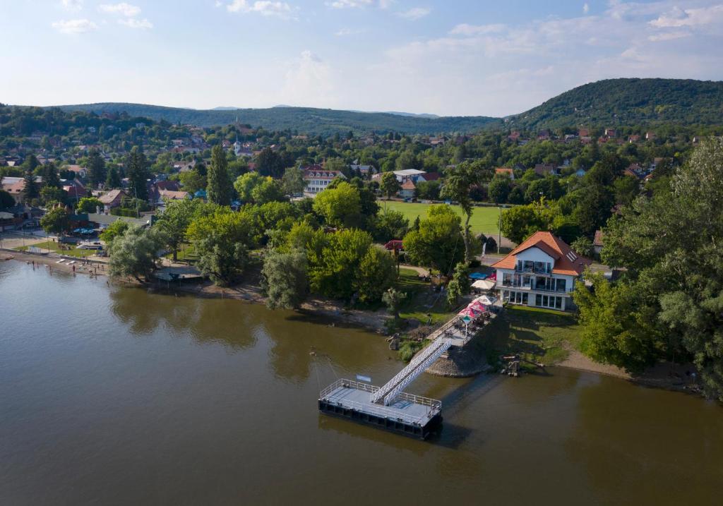 an aerial view of a town on a river at Duna P'Art Panzió in Verőce