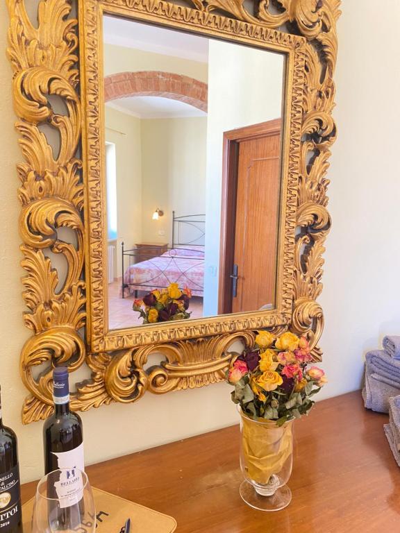 A bed or beds in a room at Affittacamere La Torre di Montalcino