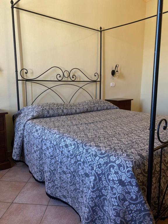 A bed or beds in a room at Affittacamere La Torre di Montalcino