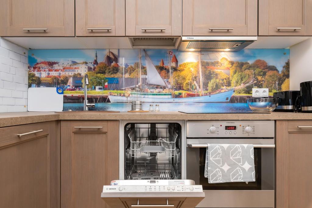 Kuchyň nebo kuchyňský kout v ubytování Cozy Foorum Apartment - Tallinn City Centre