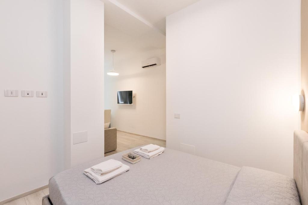 Posteľ alebo postele v izbe v ubytovaní MagnoliaApartments - 18A Visconti Duomo