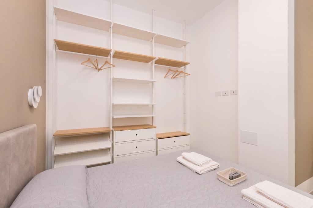 Posteľ alebo postele v izbe v ubytovaní MagnoliaApartments - 18A Visconti Duomo