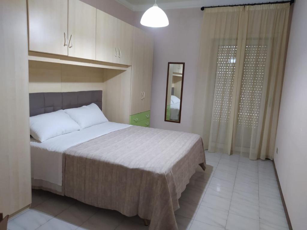 a bedroom with a large bed and a mirror at Dony's holiday homes CISE 14923 