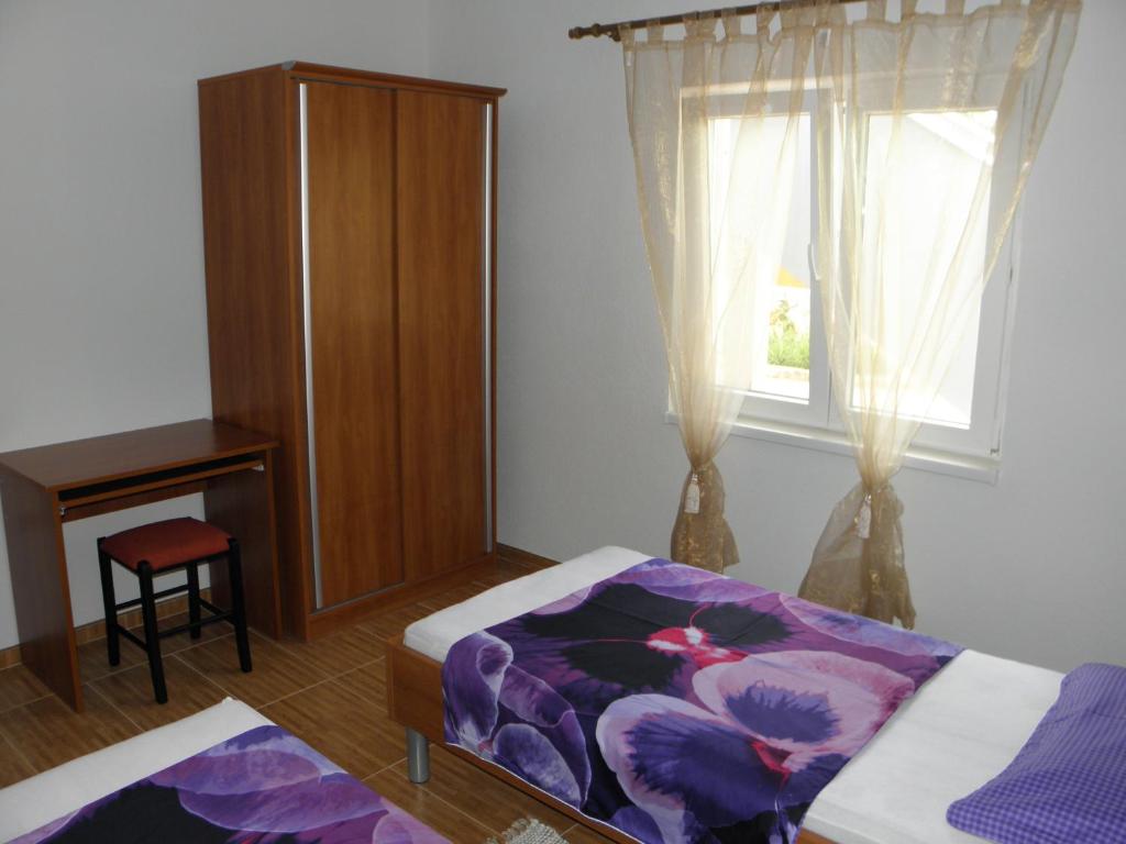 Postel nebo postele na pokoji v ubytování Apartments Babić