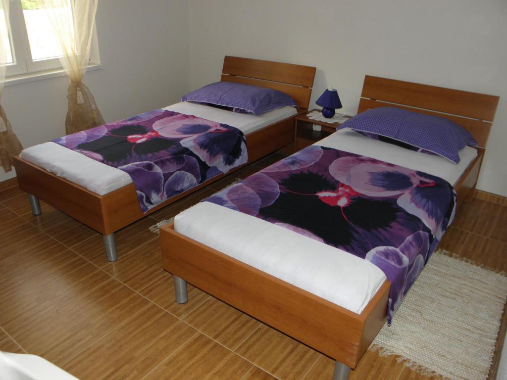 Postel nebo postele na pokoji v ubytování Apartments Babić