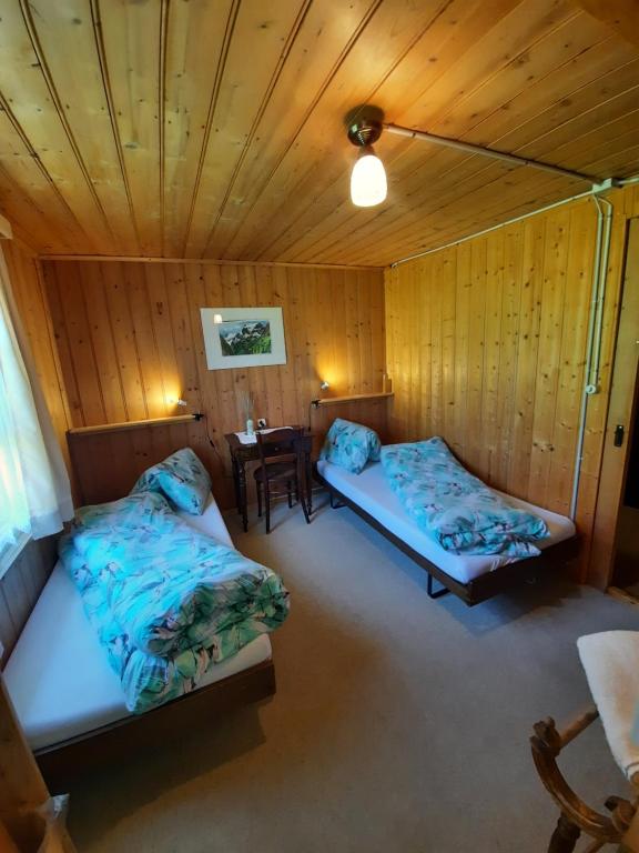 Postel nebo postele na pokoji v ubytování Berggasthaus Obbort