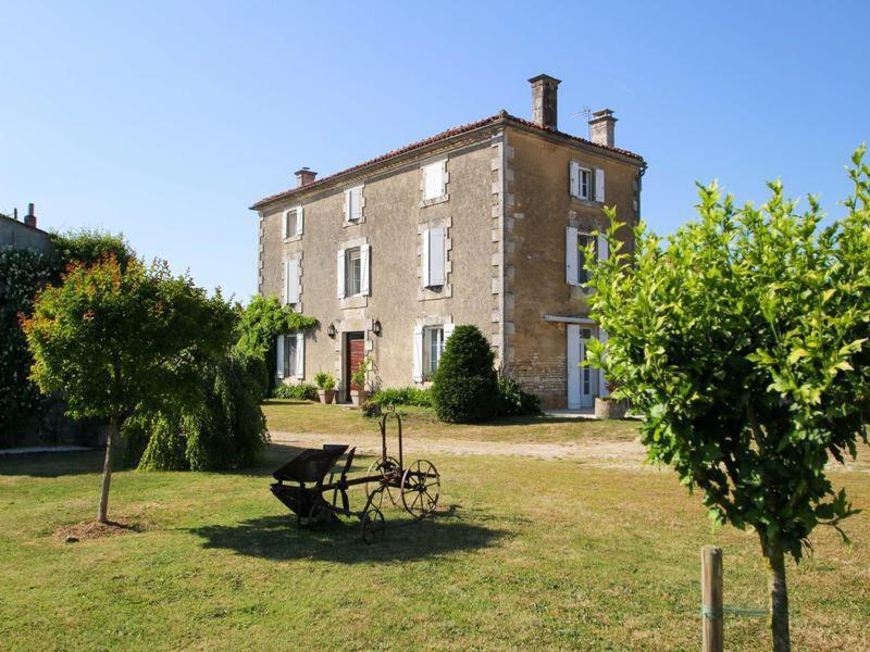 an old building with a bench in front of it at NO5 Chambre D'hotes in Courcôme