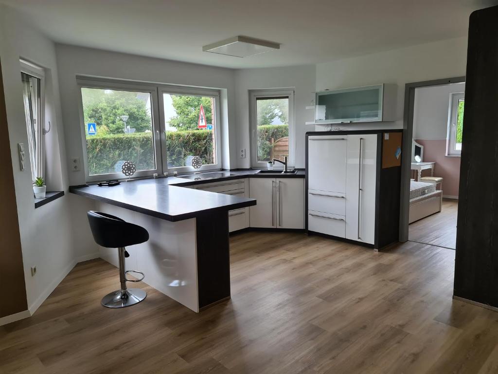 a kitchen with a large island in the middle at Große Ferienwohnung Nähe Flughafen Köln Bonn in Troisdorf