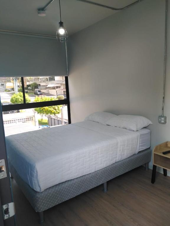 Postel nebo postele na pokoji v ubytování Nomada Republic Hotel Panama City