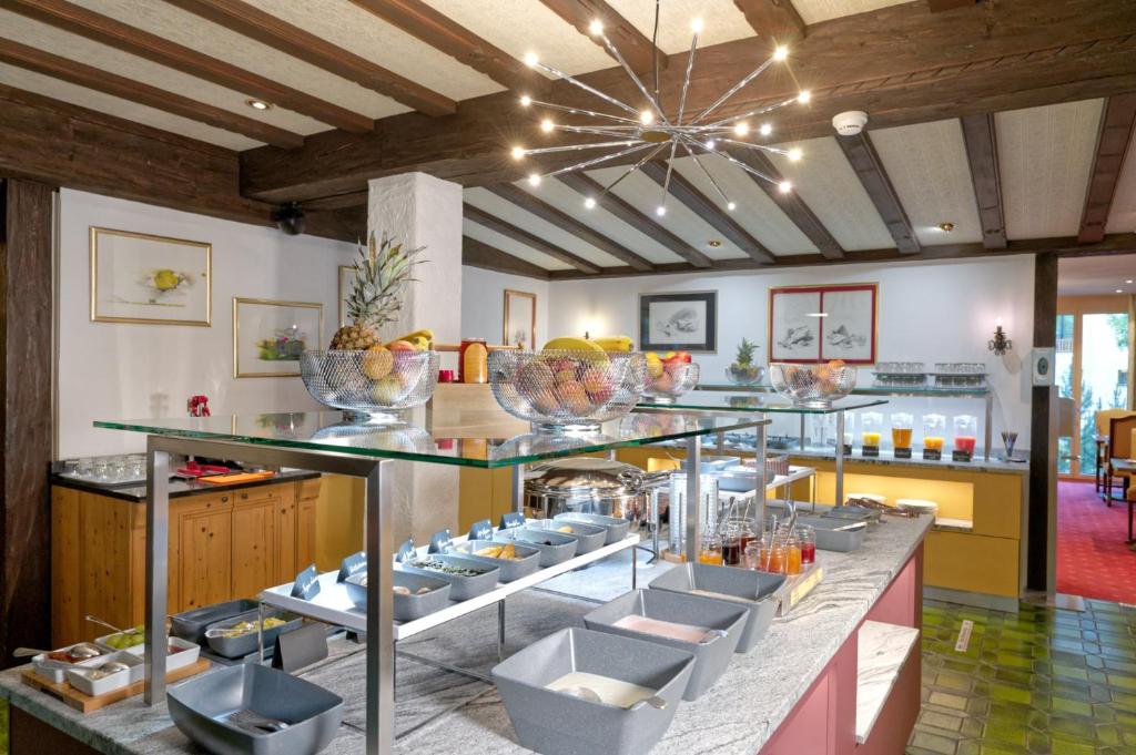 Ein Restaurant oder anderes Speiselokal in der Unterkunft Arca Aparthotel &amp; Spa 
