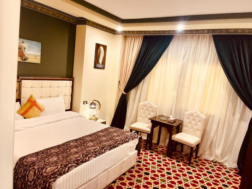 Postel nebo postele na pokoji v ubytování Omar Elkhaiam Hotel