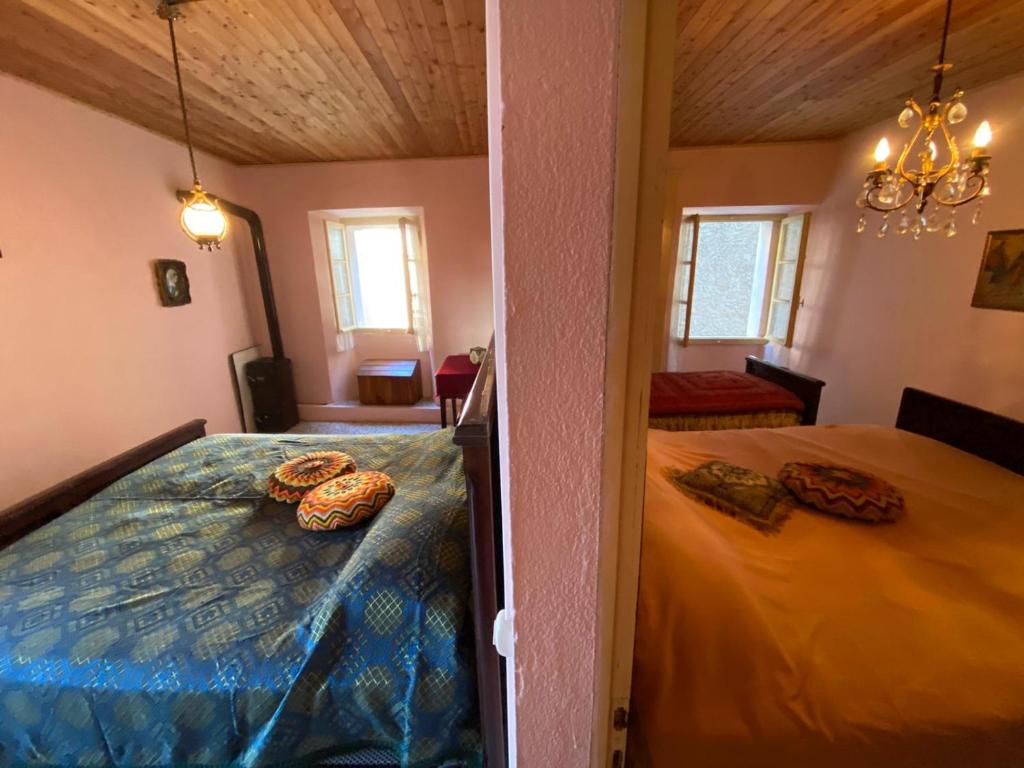 Un pat sau paturi într-o cameră la Casa vacanze Colma