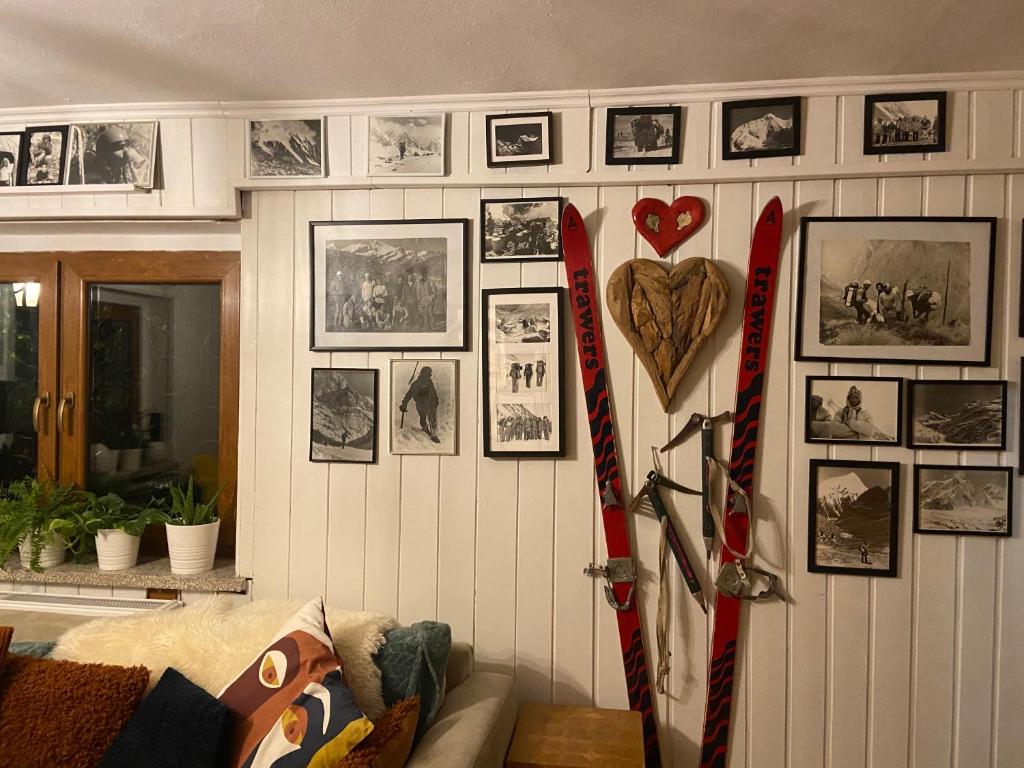 a room with skis and pictures on the wall at Małe Schronisko in Szczyrk