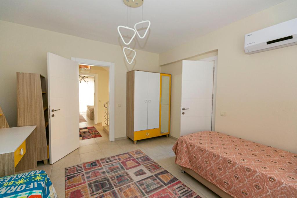 Postel nebo postele na pokoji v ubytování Paradise Town Villa Beliza