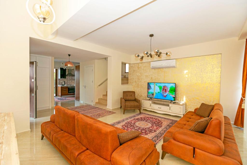 TV a/nebo společenská místnost v ubytování Paradise Town Villa Beliza