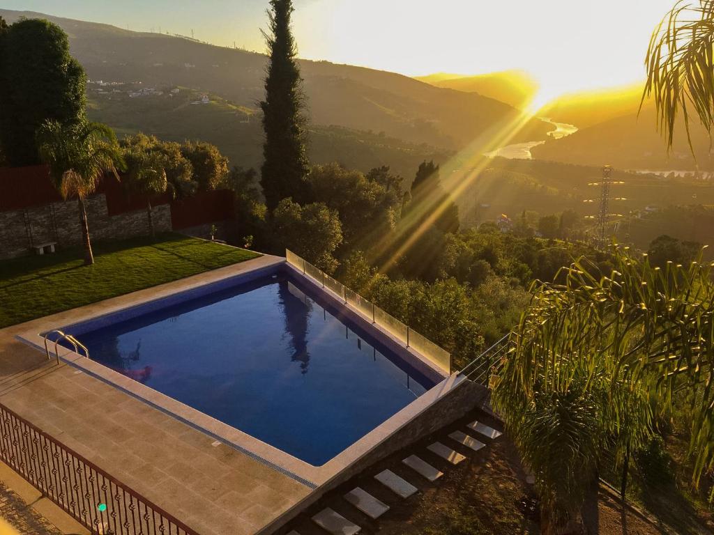 a swimming pool with a view of a mountain at Golden Mirror in Lamego