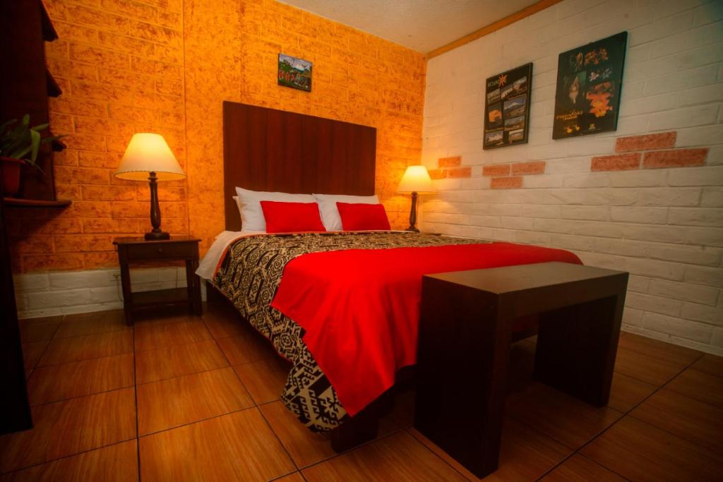 Postel nebo postele na pokoji v ubytování La Floresta Hotel