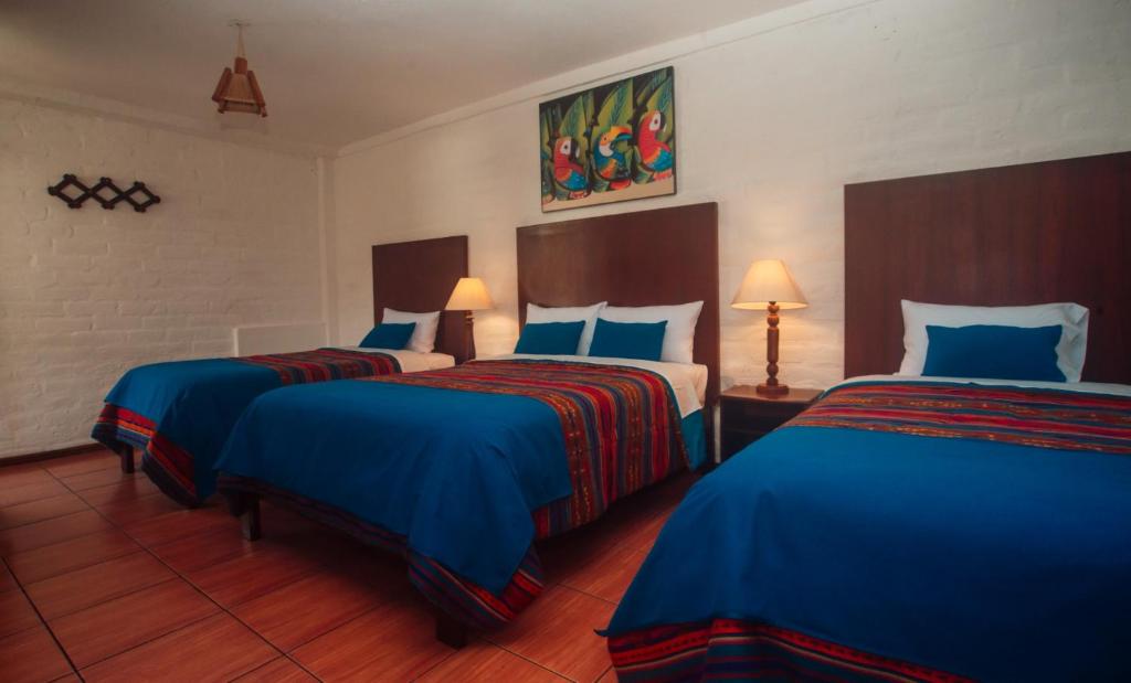 Postel nebo postele na pokoji v ubytování La Floresta Hotel