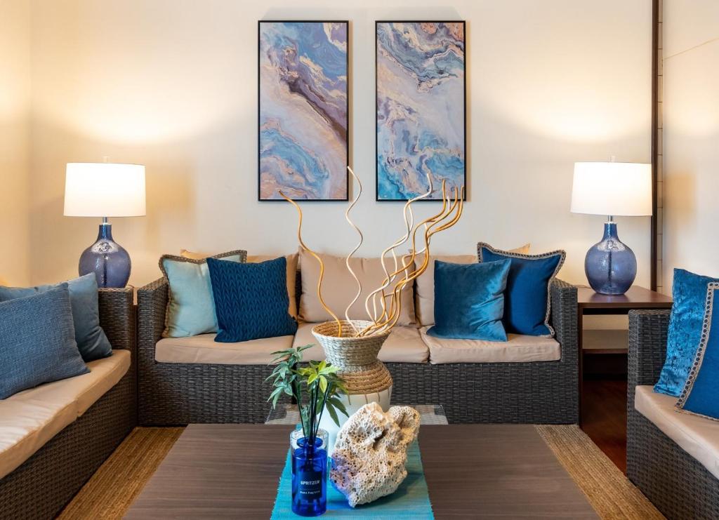 a living room with two couches and a table at ISHIGAKI HOUSE - Vacation STAY 32172v in Ishigaki Island