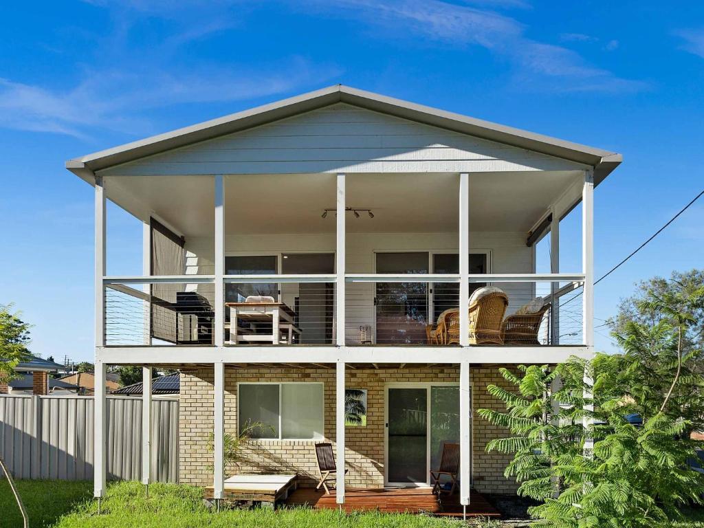 a house with a wrap around porch at Centaur Sanctuary by Experience Jervis Bay in Sanctuary Point
