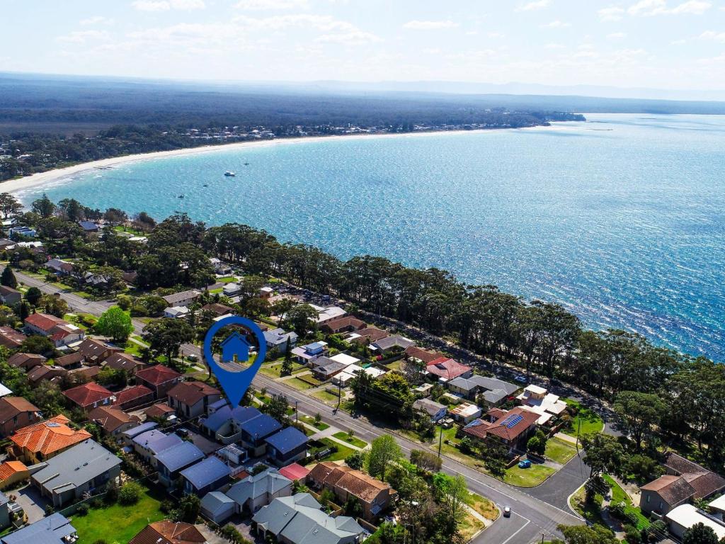an aerial view of a town with a blue arrow sign at Portside at The Arc by Experience Jervis Bay in Vincentia