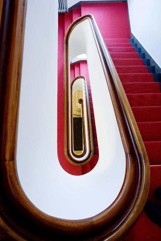 an escalator in an airplane with a phone on it at XII Apostel Albergo in Cologne